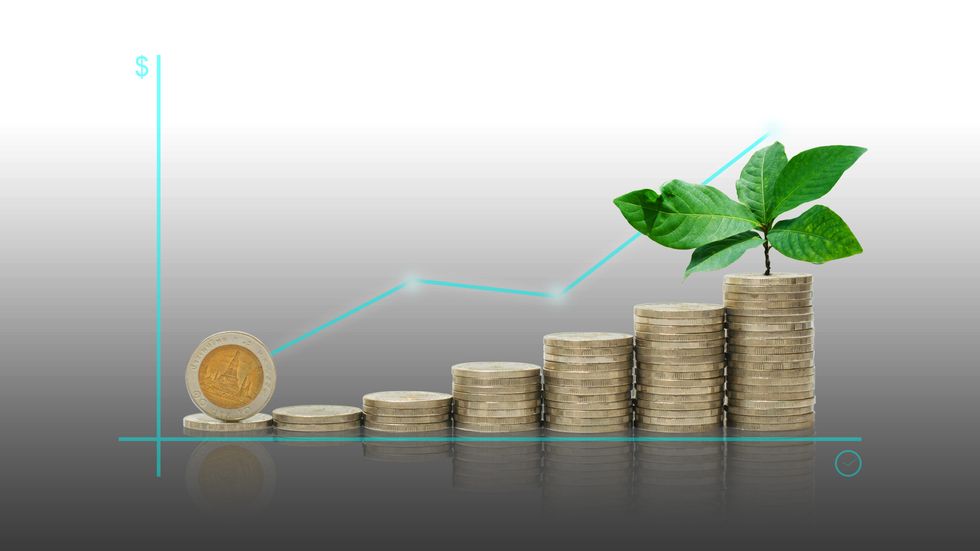 coin startup on coins stacking with green leaves plant growth up on top with graph up success on project planning or forecast. financial and saving concept. ESG Environmental Social Governance.